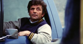 Movie still from “A Woman Under the Influence” (1974), directed by John Cassavetes – A man sitting in the back seat of a blue car; Close Up shot, Low angle