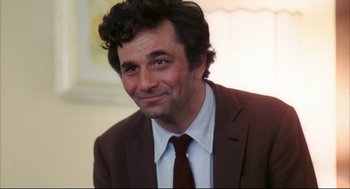 Movie still from “A Woman Under the Influence” (1974), directed by John Cassavetes – A person wearing a suit and tie; Close Up shot, Low angle