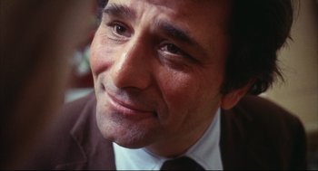 Movie still from “A Woman Under the Influence” (1974), directed by John Cassavetes – A person wearing a suit and tie; Close Up shot, Low angle
