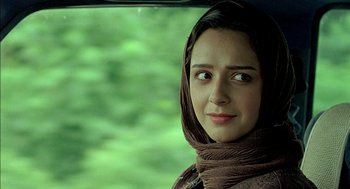 Movie still from “About Elly” (2009), directed by Asghar Farhadi – A woman with a head scarf is sitting in a car; Close Up shot, Over the shoulder angle