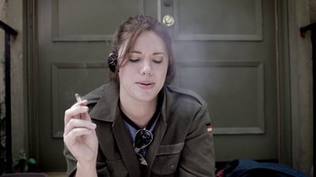 Movie still from “Absentia” (2011), directed by Mike Flanagan – A woman smoking a cigarette while talking on the phone; Close Up shot, Overhead angle