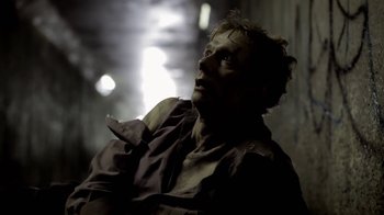 Movie still from “Absentia” (2011), directed by Mike Flanagan – A man in a dark room looking up at the ceiling; Close Up shot, Low angle