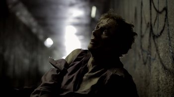 Movie still from “Absentia” (2011), directed by Mike Flanagan – A person wearing a shirt; Close Up shot, Low angle