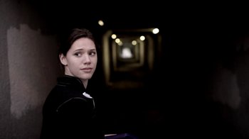 Movie still from “Absentia” (2011), directed by Mike Flanagan – A woman in a black jacket is in a dark tunnel; Close Up shot, Low angle