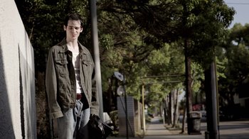 Movie still from “Absentia” (2011), directed by Mike Flanagan – A man standing on the side of the street; Medium shot, Low angle