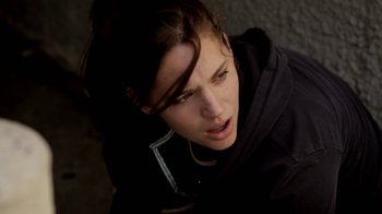 Movie still from “Absentia” (2011), directed by Mike Flanagan – A woman in a black jacket is looking at the camera; Close Up shot, Low angle