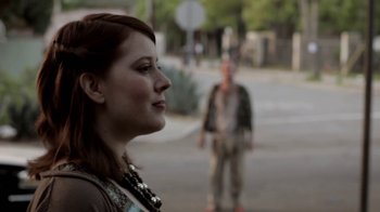 Movie still from “Absentia” (2011), directed by Mike Flanagan – A man and a woman standing on the side of a road; Close Up shot, Over the shoulder angle