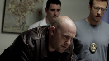 Movie still from “Absentia” (2011), directed by Mike Flanagan – A man with a shaved head and a man with a shaved head; Medium shot, Over the shoulder angle