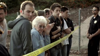 Movie still from “Absentia” (2011), directed by Mike Flanagan – A group of men and women standing next to each other; Medium shot, Over the shoulder angle