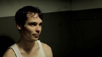 Movie still from “Absentia” (2011), directed by Mike Flanagan – A person wearing a tank top; Close Up shot, Low angle