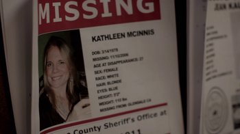 Movie still from “Absentia” (2011), directed by Mike Flanagan – A missing persons poster of a woman with missing information; Extreme Close Up shot, Overhead angle