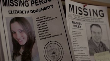 Movie still from “Absentia” (2011), directed by Mike Flanagan – Two missing persons flyers are sitting next to each other; Extreme Close Up shot, Overhead angle