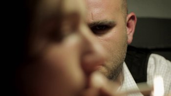 Movie still from “Absentia” (2011), directed by Mike Flanagan – A man's face with his eyes wide open; Extreme Close Up shot, Over the shoulder angle