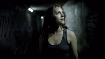 Movie still from “Absentia” (2011), directed by Mike Flanagan – A woman standing in a dark room looking up; Close Up shot, Low angle