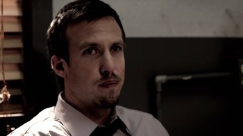 Movie still from “Absentia” (2011), directed by Mike Flanagan – A person wearing a shirt and a tie; Close Up shot, Low angle