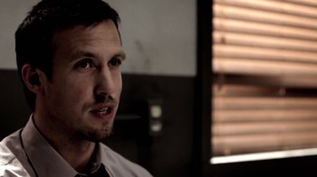 Movie still from “Absentia” (2011), directed by Mike Flanagan – A person wearing a shirt and tie; Close Up shot, Low angle