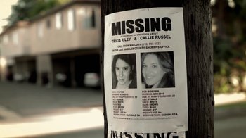 Movie still from “Absentia” (2011), directed by Mike Flanagan – A missing poster of a missing person on the side of the road; Close Up shot, Low angle