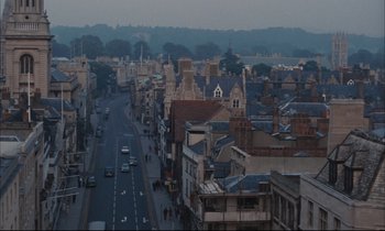Movie still from “Accident” (1967), directed by Joseph Losey – An aerial view of a city with many buildings; Extreme Wide shot, High angle
