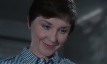 Movie still from “Accident” (1967), directed by Joseph Losey – A person wearing a shirt and tie; Close Up shot, High angle