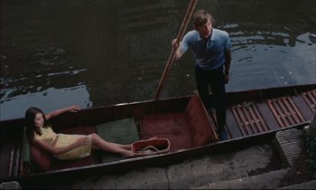 Movie still from “Accident” (1967), directed by Joseph Losey – A man and a woman in a boat on the water; Wide shot, High angle