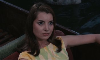 Movie still from “Accident” (1967), directed by Joseph Losey – A woman sitting in a boat in the water; Close Up shot, High angle