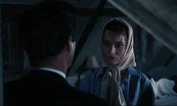 Movie still from “Accident” (1967), directed by Joseph Losey – A man and a woman are looking at each other; Close Up shot, Over the shoulder angle