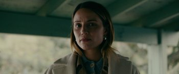 Movie still from “Acidman” (2022), directed by Alex Lehmann – A person wearing a jacket; Close Up shot, Over the shoulder angle