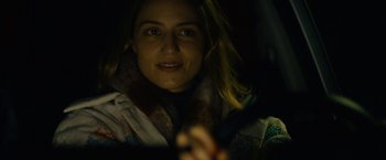 Movie still from “Acidman” (2022), directed by Alex Lehmann – A person in a car at night; Close Up shot, Over the shoulder angle