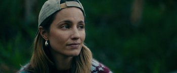 Movie still from “Acidman” (2022), directed by Alex Lehmann – A person wearing a hat; Close Up shot, Over the shoulder angle