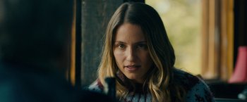 Movie still from “Acidman” (2022), directed by Alex Lehmann – A person with long hair; Close Up shot, Over the shoulder angle