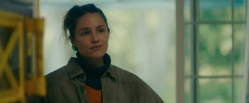 Movie still from “Acidman” (2022), directed by Alex Lehmann – A person wearing a jacket; Close Up shot, Over the shoulder angle