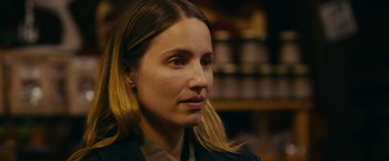 Movie still from “Acidman” (2022), directed by Alex Lehmann – A person with long blonde hair; Close Up shot, Over the shoulder angle