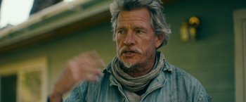 Movie still from “Acidman” (2022), directed by Alex Lehmann – An older man with a gray beard is talking; Close Up shot, Low angle