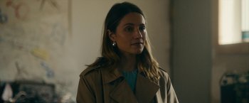 Movie still from “Acidman” (2022), directed by Alex Lehmann – A person wearing a jacket; Close Up shot, Over the shoulder angle