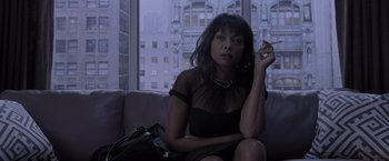 Movie still from “Acrimony” (2018), directed by Tyler Perry – A woman sitting on top of a couch in front of a window; Close Up shot, High angle