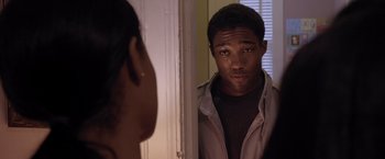 Movie still from “Acrimony” (2018), directed by Tyler Perry – A man looking into a mirror while standing next to a woman; Close Up shot, Over the shoulder angle
