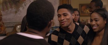 Movie still from “Acrimony” (2018), directed by Tyler Perry – Two young men are talking to each other in a room; Close Up shot, Over the shoulder angle