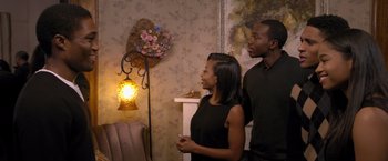 Movie still from “Acrimony” (2018), directed by Tyler Perry – A man and a woman standing next to each other in a room; Medium shot, Over the shoulder angle