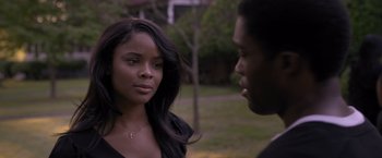 Movie still from “Acrimony” (2018), directed by Tyler Perry – A woman standing next to a man in a park; Close Up shot, Over the shoulder angle