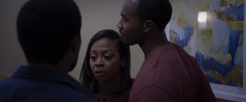 Movie still from “Acrimony” (2018), directed by Tyler Perry – A man and a woman standing next to each other in a room; Close Up shot, Over the shoulder angle