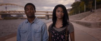 Movie still from “Acrimony” (2018), directed by Tyler Perry – A man and a woman standing next to each other; Medium shot, Over the shoulder angle