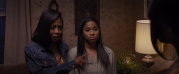 Movie still from “Acrimony” (2018), directed by Tyler Perry – Two women standing next to each other and one of them is pointing; Medium shot, Over the shoulder angle