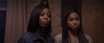 Movie still from “Acrimony” (2018), directed by Tyler Perry – Two women are standing next to each other in a room; Close Up shot, Over the shoulder angle