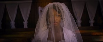 Movie still from “Acrimony” (2018), directed by Tyler Perry – A woman wearing a wedding dress with a veil; Close Up shot, Low angle