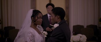 Movie still from “Acrimony” (2018), directed by Tyler Perry – A man and a woman in a wedding ceremony; Close Up shot, Over the shoulder angle