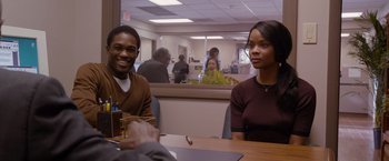 Movie still from “Acrimony” (2018), directed by Tyler Perry – A man and a woman are sitting at a table; Medium shot, Over the shoulder angle