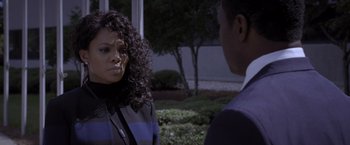 Movie still from “Acrimony” (2018), directed by Tyler Perry – A woman and a man standing next to each other outside; Close Up shot, Over the shoulder angle