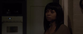 Movie still from “Acrimony” (2018), directed by Tyler Perry – A woman in a dark room looking at the camera; Close Up shot, Over the shoulder angle
