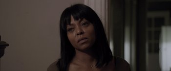 Movie still from “Acrimony” (2018), directed by Tyler Perry – A person wearing a necklace; Close Up shot, Over the shoulder angle