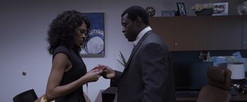 Movie still from “Acrimony” (2018), directed by Tyler Perry – A man and a woman holding hands in a room; Medium shot, High angle